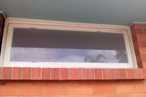 New bathroom window glazing using frosted glass.